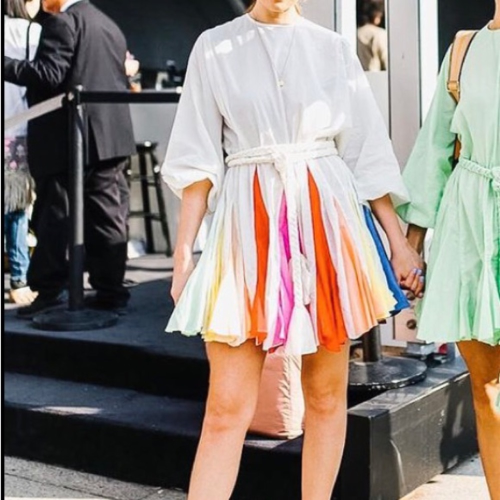 Beautiful women’s dress with color inserts on skirt and a rope tie belt.